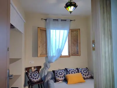a living room with a couch and a window at Casa Salvadora in Algar