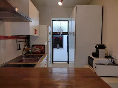 a kitchen with a sink and a refrigerator at Casa Salvadora in Algar