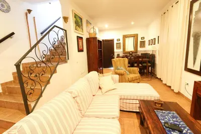 a living room with a couch and a table at Los Candiles in Conil de la Frontera