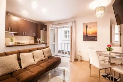 a living room with a couch and a table at Gades Suite in Cádiz