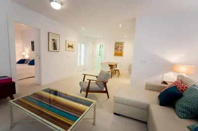 a living room with a couch and a table at Apartamento Rosario 49 in Cádiz