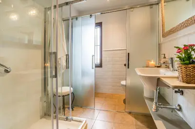 a bathroom with a shower and a sink at Vivienda Rural Olivar de San Telmo in Arcos de la Frontera