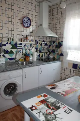 a kitchen with a sink and a washing machine at Casas Lomas II in Arcos de la Frontera