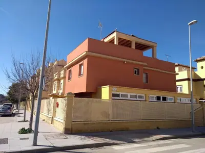 a building on the side of a street at Casas Turísticas Bajamar in Sanlúcar de Barrameda