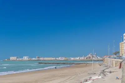 a view of a beach with the ocean and buildings at Atico FULL Balcony by Cadiz4Rentals in Cádiz