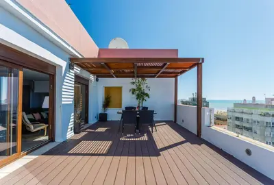 a balcony with a table and a view of the ocean at Atico FULL Balcony by Cadiz4Rentals in Cádiz