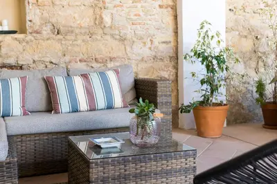 a living room with a couch and a coffee table at Cream Loft Siente Jerez Parking Incluido in Jerez de la Frontera