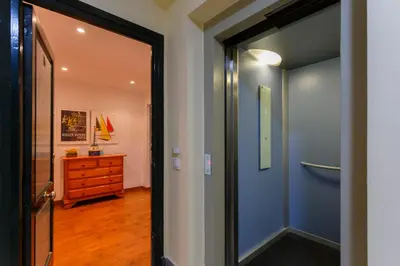 a hallway with a door leading to a room with a dresser at OCEANO Family Home free parking by Cadiz4Rentals in Cádiz