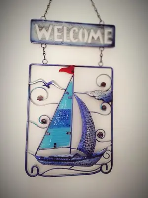 a sign that says welcome with a picture of a sailboat at Hostal Casa Nautilus in Cádiz