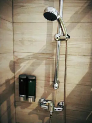 a shower in a bathroom with a shower head at Hostal Casa Nautilus in Cádiz