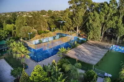 an overhead view of a house with a swimming pool at Glamping -Bungalows El Faro in Conil de la Frontera