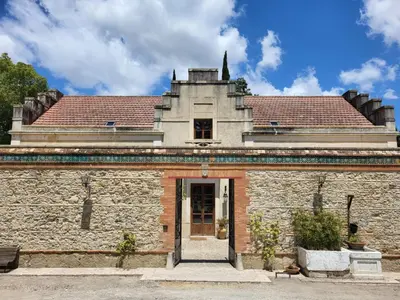 an old stone building with a red roof at Casa Viña de Alcántara in Jerez de la Frontera