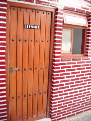 a building with a door with the word railways on it at Pensión San Andrés I in Jerez de la Frontera
