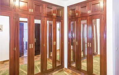 a room with wood paneling and glass doors at Awesome Home In Arcos De La Frontera in Arcos de la Frontera