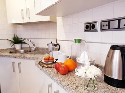 a kitchen counter with fruit on a counter top at Sherryflat Fate in Jerez de la Frontera