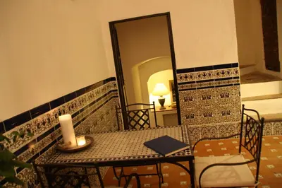a candle sitting on a table in a balcony at Bed & Breakfast Casa El Sueño in Arcos de la Frontera