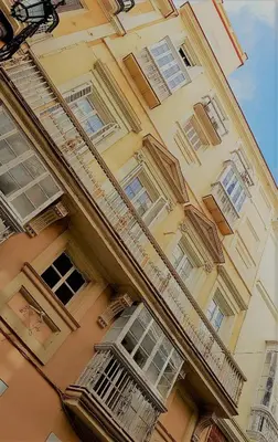 a building with balconies on the side of it at No 14 Cádiz in Cádiz