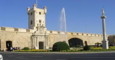 a large brick building with a tower on top of it at No 14 Cádiz in Cádiz