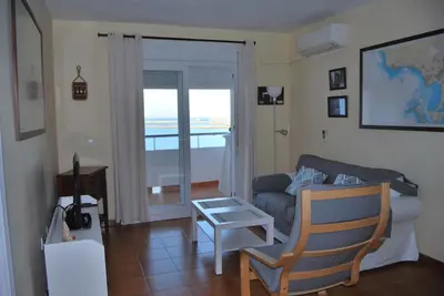 a living room with a couch and a chair at La casa De Los Faros in El Puerto de Santa María