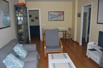 a living room with a couch and a table at La casa De Los Faros in El Puerto de Santa María