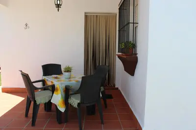 a dining room with a table and chairs at Casa Colada 3 in Conil de la Frontera