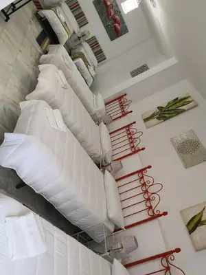 two chairs sitting next to each other with a plant at Big House Jerez in Jerez de la Frontera