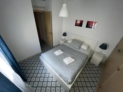 a bedroom with a bed with two pillows on it at El Rincón de la Playa SantaMaría Grupo AC Gestion in Cádiz