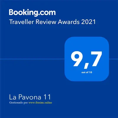 a blue box with the text travel review awards at La Pavona 11 - 1ª línea de Playa Chipiona in Chipiona
