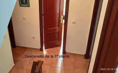 a hallway with an open door and a floor at La Pavona 11 - 1ª línea de Playa Chipiona in Chipiona