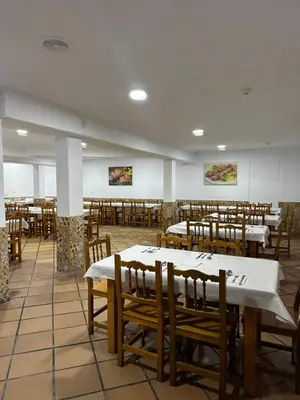 a dining room filled with tables and chairs at Hotel Quitagolpe in Jerez de la Frontera