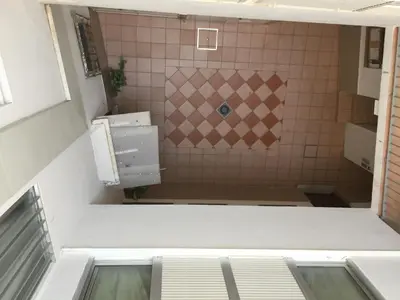 a small bathroom with a shower and a sink at La Joya de la Caleta. A 60 mts playa. in Cádiz