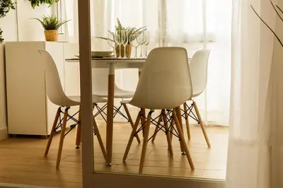 a table and four chairs in a room with a table at Pisoelpuerto in El Puerto de Santa María