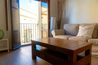 a living room with a couch and a coffee table at Light House Sherry in Jerez de la Frontera