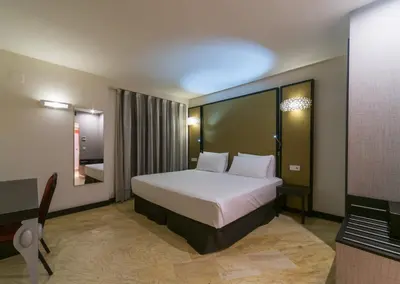 a hotel room with a bed and a desk at Hotel Palacio Marqués de Arizón in Sanlúcar de Barrameda