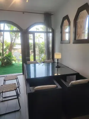 a dining room with a glass table and chairs at Luz de la Bahía San Fernando Cádiz in San Fernando