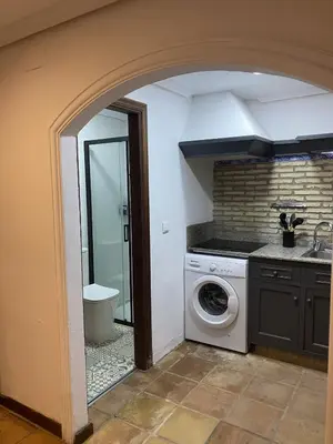 a laundry room with a washer and dryer at Luz de la Bahía San Fernando Cádiz in San Fernando