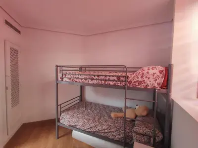 a bedroom with two bunk beds in a room at Luz de la Bahía San Fernando Cádiz in San Fernando