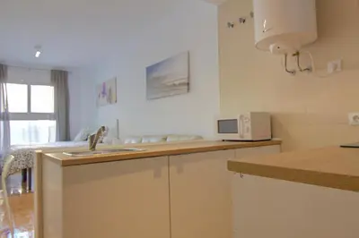 a kitchen with a sink and a microwave at apartamento plaza san juan in El Puerto de Santa María