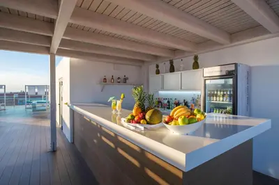 a kitchen with a bowl of fruit on a counter at Hotel Best Costa Ballena in Costa Ballena