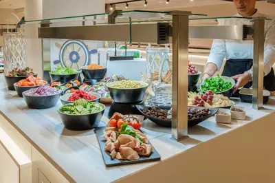 a buffet line with many different types of food at Hotel Best Costa Ballena in Costa Ballena