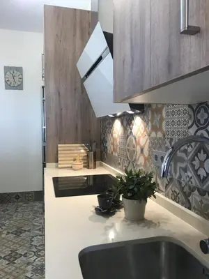 a kitchen with a sink and a counter top at Villa Chill In in Chiclana de la Frontera