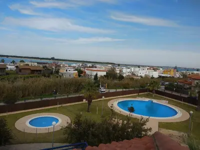 a view of two swimming pools in a city at Apartamento Estrella in Sanlúcar de Barrameda