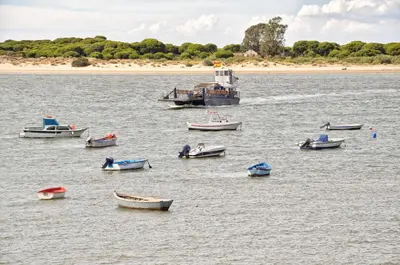 a group of boats in a large body of water at Apartamento Estrella in Sanlúcar de Barrameda