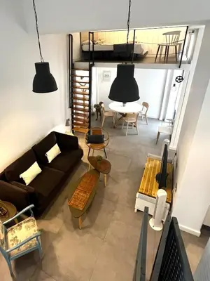 a living room with a couch and a table at Lofts Miriam in Cádiz