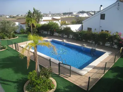 an overhead view of a swimming pool in a yard at Apartamentos Los Olivos in Conil de la Frontera