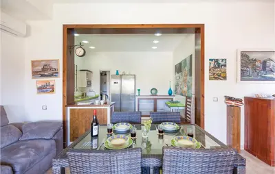 a living room with a table and a couch at Nice Home In Arcos De La Frontera in Arcos de la Frontera