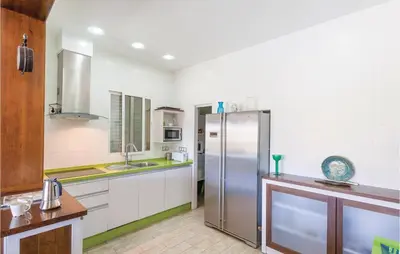 a kitchen with a stainless steel refrigerator at Nice Home In Arcos De La Frontera in Arcos de la Frontera