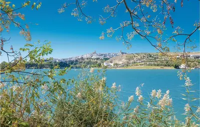 a view of a lake with a mountain in the background at Nice Home In Arcos De La Frontera in Arcos de la Frontera