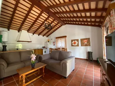 a living room with a couch and a table at Vivienda Rural Atlántico Sur & Familias in Conil de la Frontera