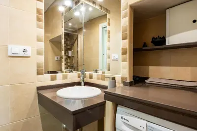 a bathroom with a sink and a mirror at Casa Plotina Pompeya in Cádiz